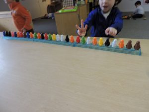 Wes counts the number of bases his penguins are standing on. 1...2...3!
